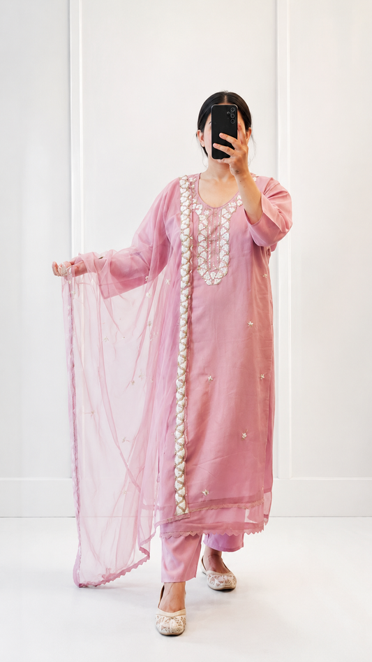 Blush pink dreams stitched with elegance and charm.